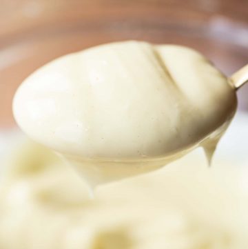 closeup shots of mayo on golden spoon