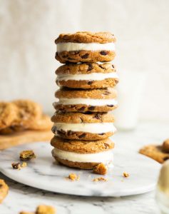 5 ice cream sandwiches stacked on each other on small marble plate