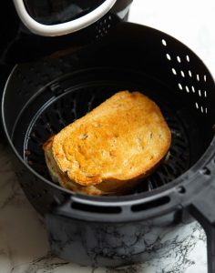 close up shot of grilled cheese in air fryer