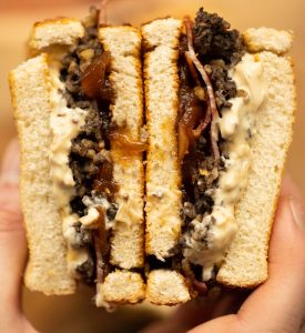 close up overhead shot of open haggis toastie showing filling