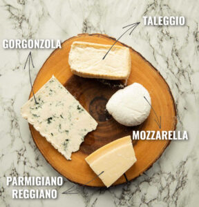 overhead shot of Italian 4 cheese combo with text labels on wooden board